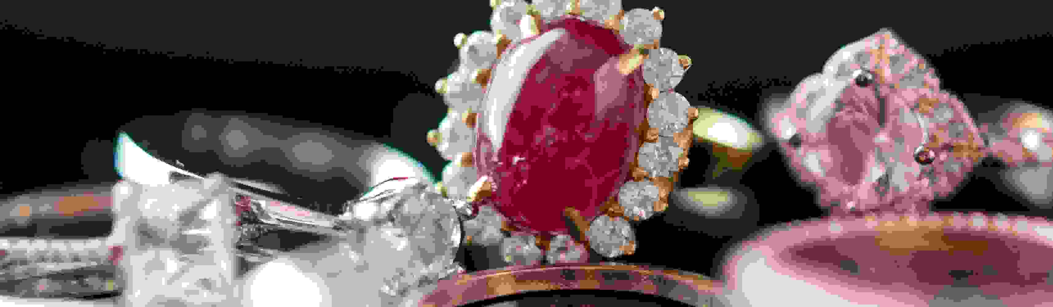 big red ruby ring with jewellery background