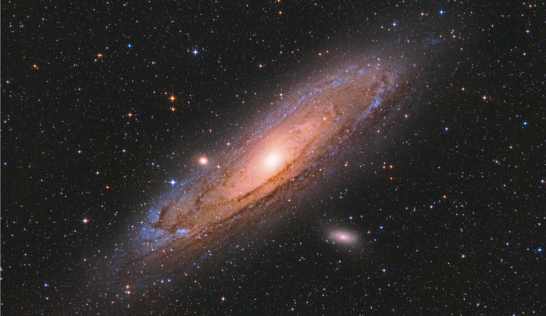 Andromeda Galaxy with colourful Stars surrounding it captured with a Telescope