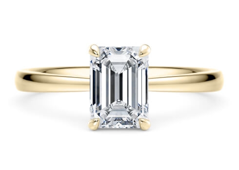 Starlight in Yellow Gold set with a Emerald cut diamond.